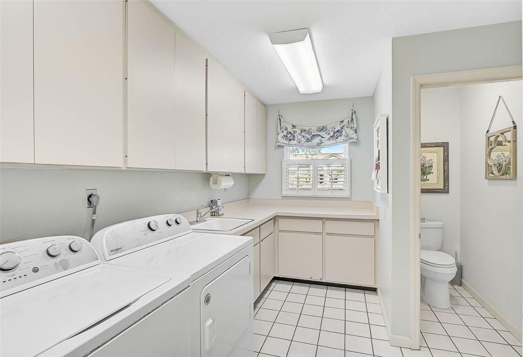 Laundry Room, with a window looking towards the front yard.  Garage entry is just to the right.  There's also a large storage closet in the laundry room.