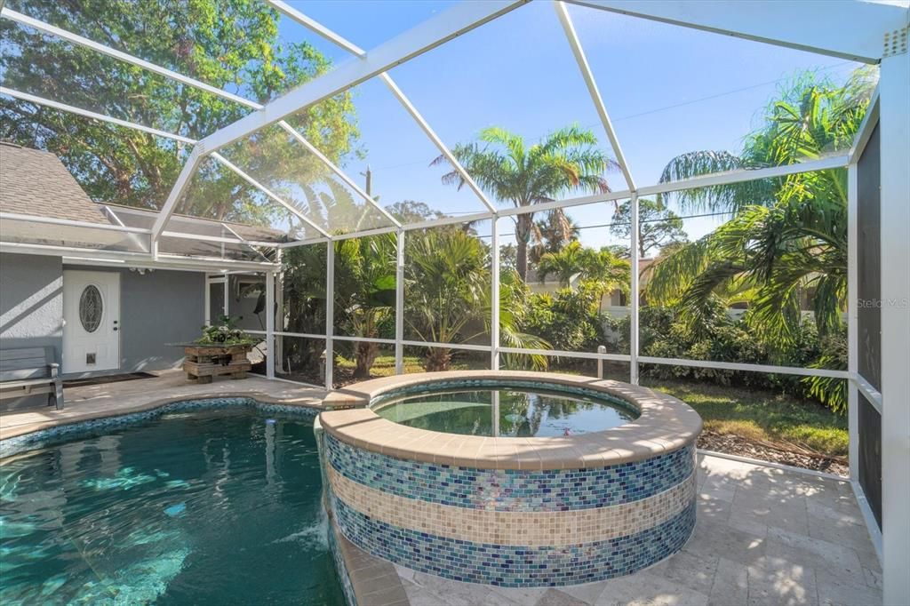 Screened pool area with spa