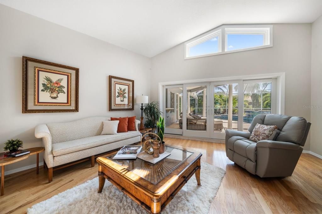 High ceilings provide natural light in the living room area