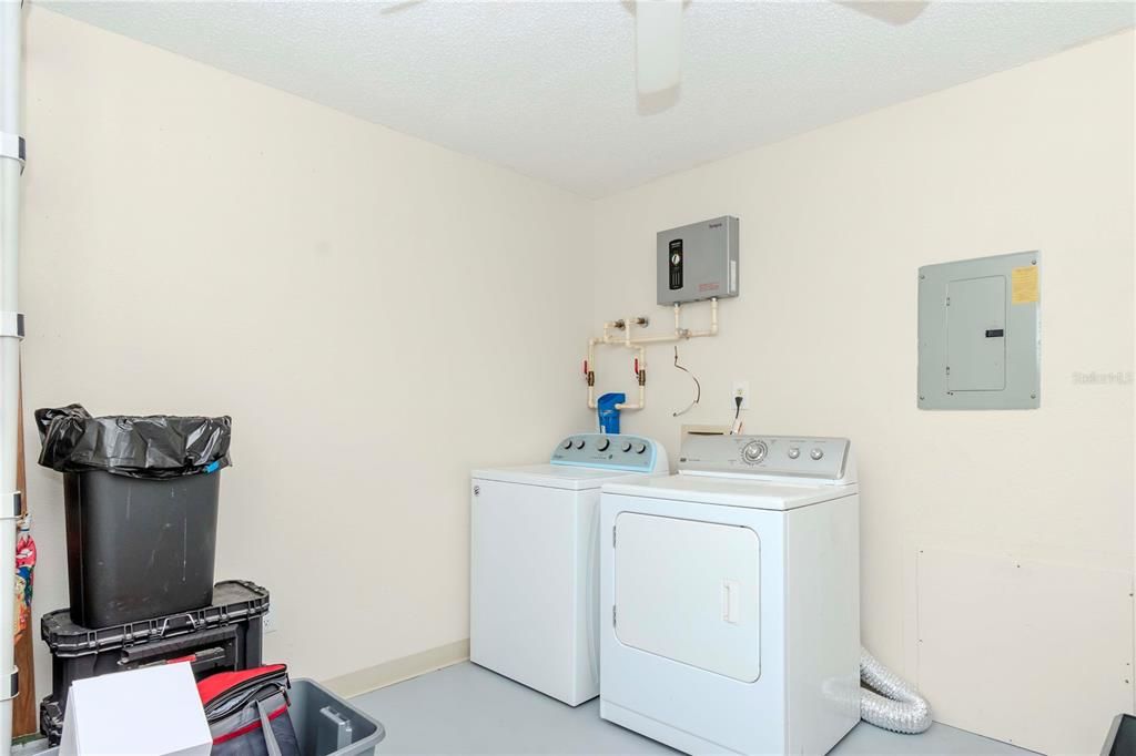 Spacious laundry room with plenty of storage.