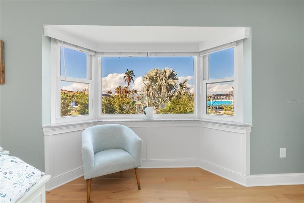 Primary Suite with bay window view of canal