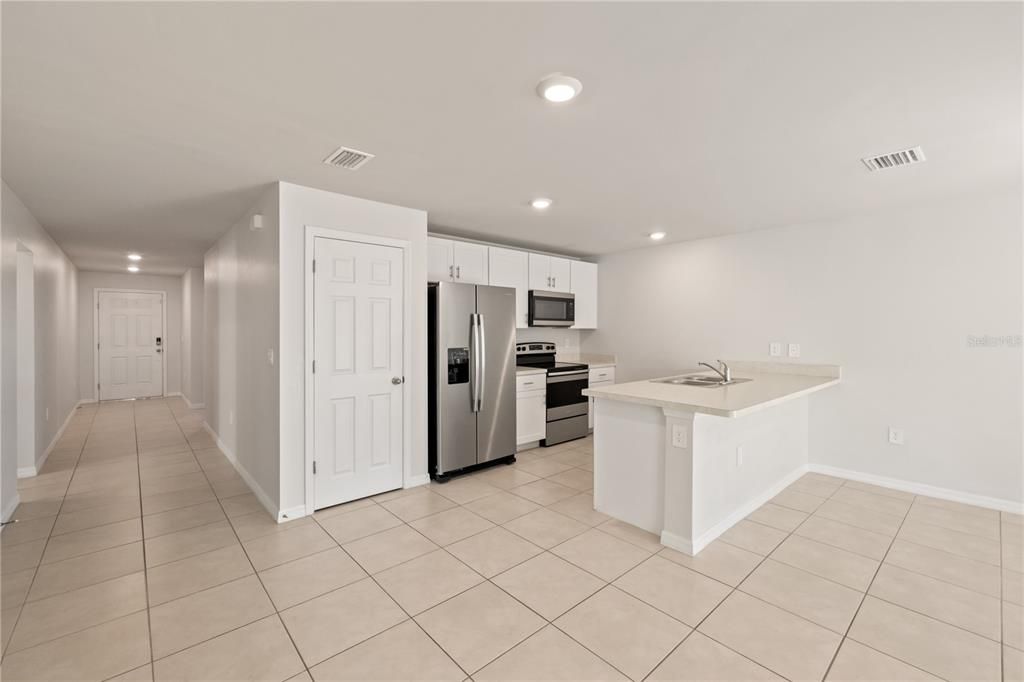 View of kitchen featuring a peninsula island.