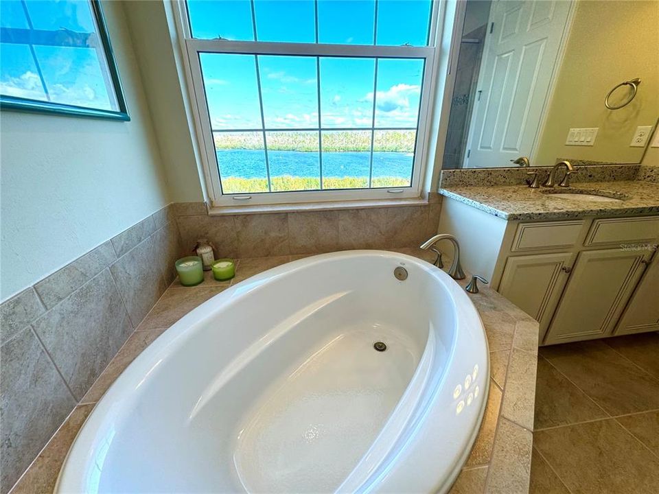 Relax in your garden tub overlooking the water!