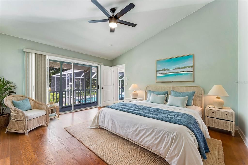 Primary Bedroom with sliding doors to pool and porch