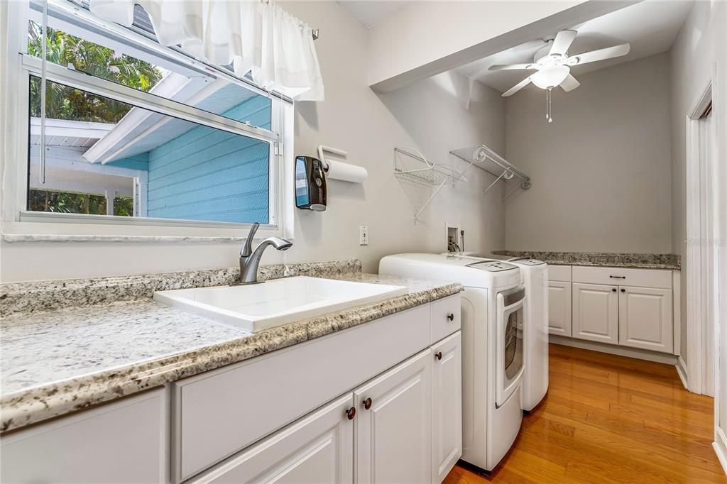 Large Laundry Room with door to back yard