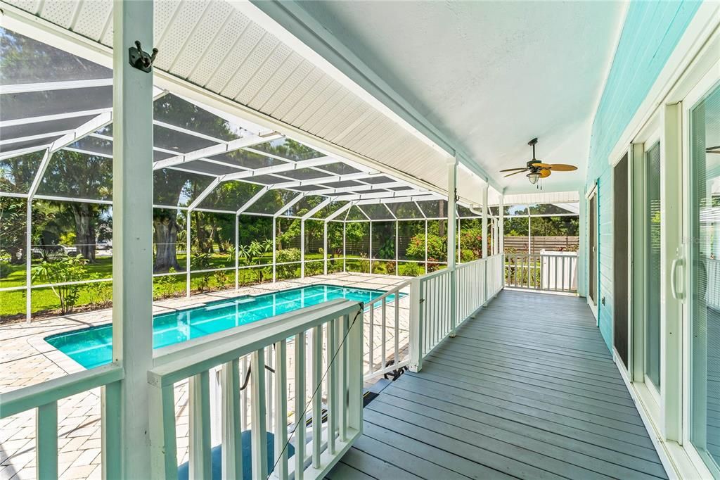 Huge back porch overlooking pool and 1 acre of land! Plenty of privacy!