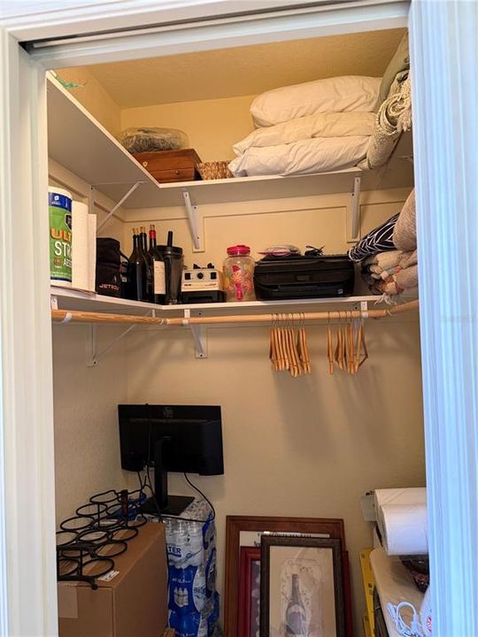 Back bedroom walk in closet with custom shelving