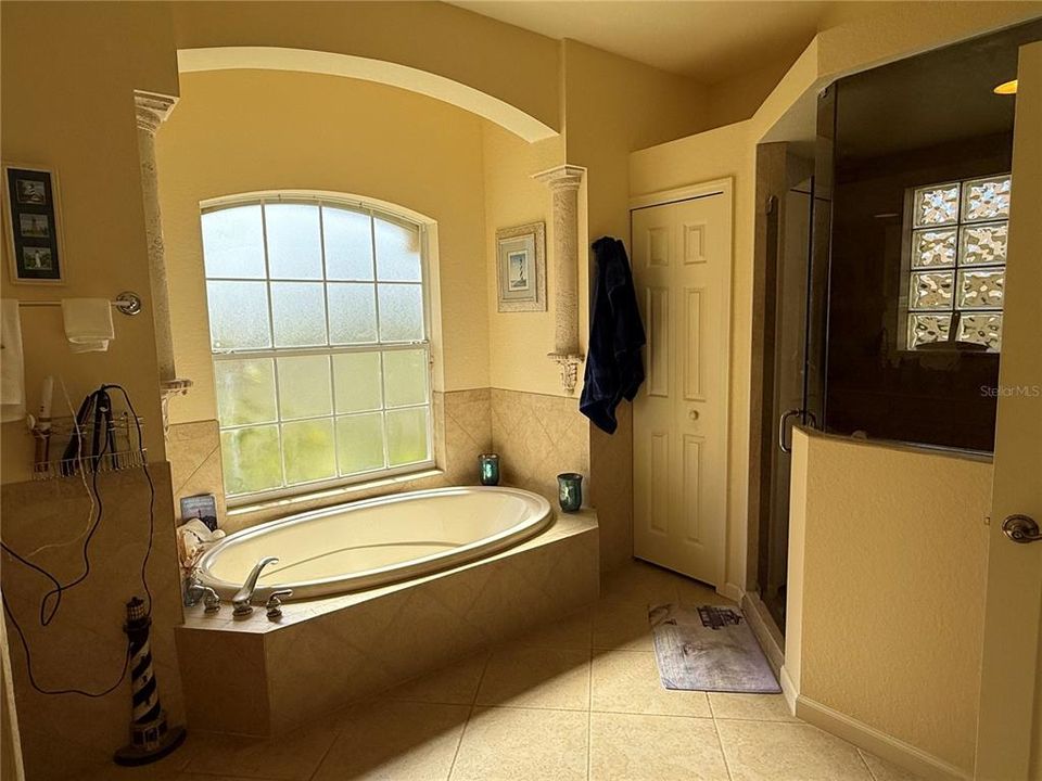 Garden tub  and linen closet in Owner's Suite bathroom