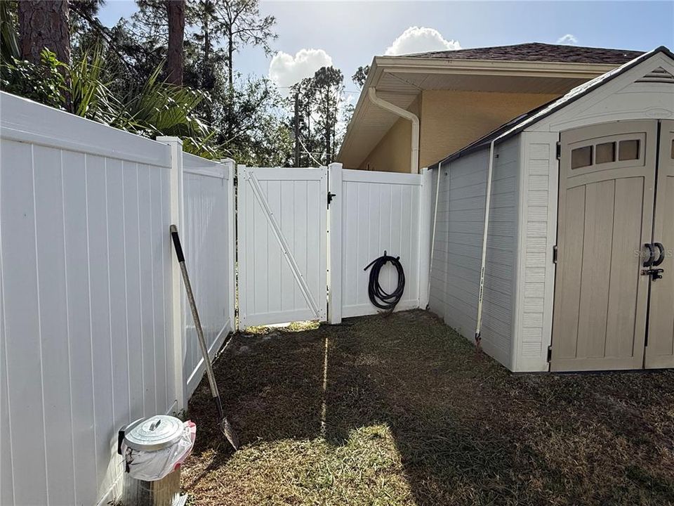 Privacy fenced in back yard.   Storage shed secured for wind