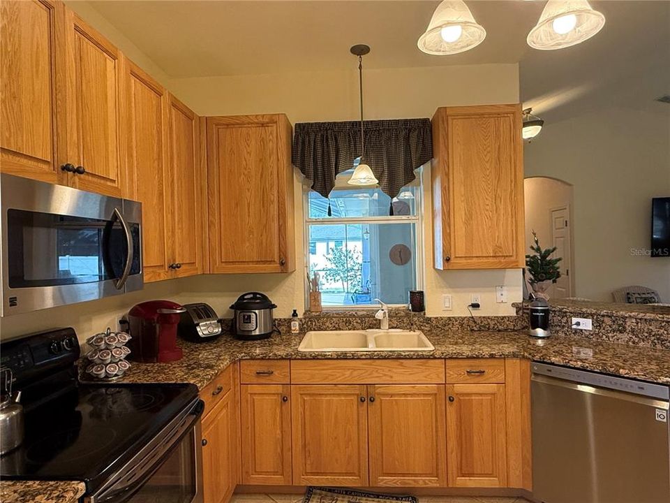 Kitchen overlooks lanai and pool