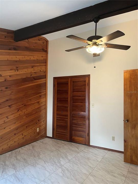 This bedroom has vaulted ceilings and is 14'2"x11'2". The spacious secondary bedrooms are on other side of house from primary BR.