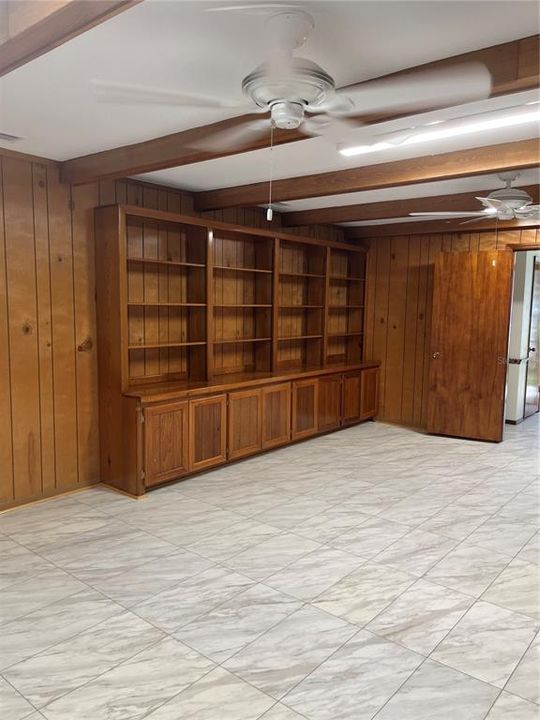 Opposite the fireplace are these built-in solid wood shelves and cabinets.