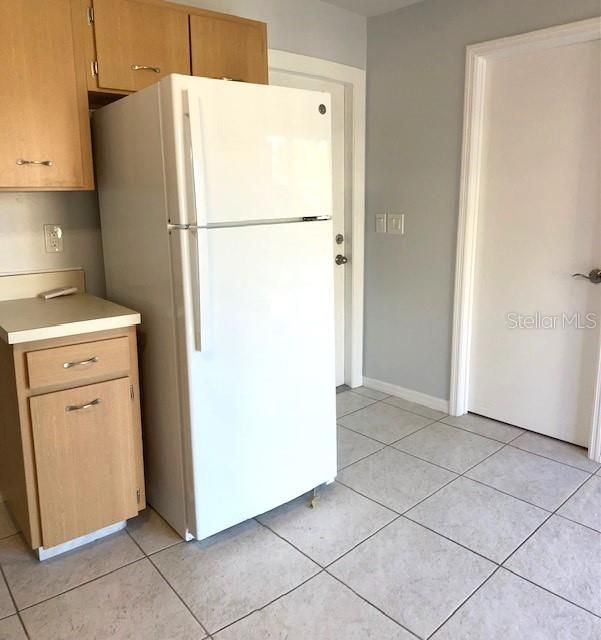 Doors to utility room and carport are convenient to the kitchen.