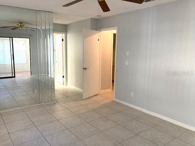 Primary bedroom, doorways into the en suite, and into the main hallway.