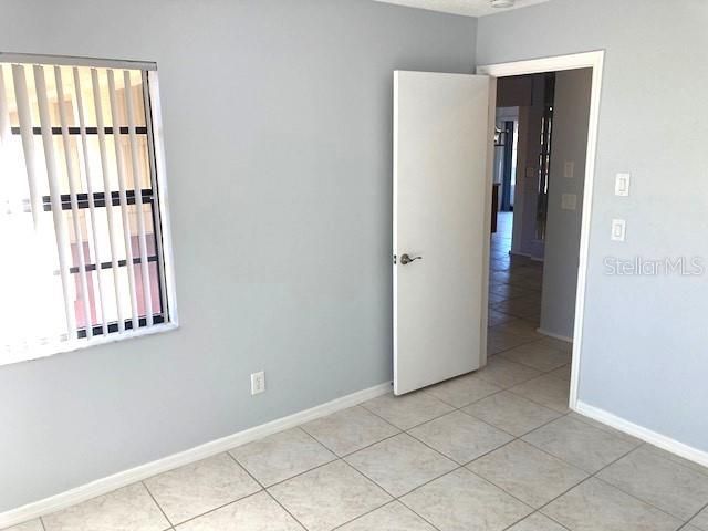 Guest bedroom, leads into hallway just off the main living area.