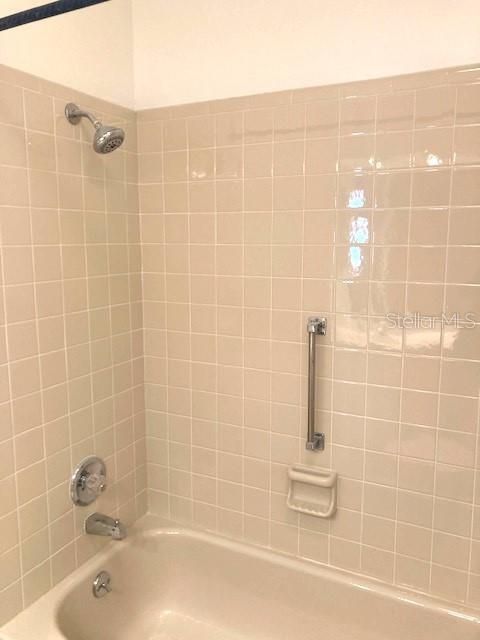 Guest bathroom, with tub and shower.