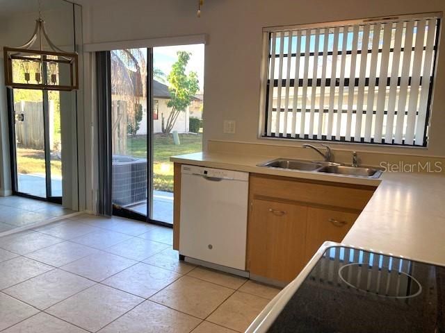 L shaped kitchen counter arrangement with plenty of storage.