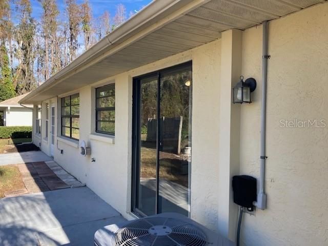 Back patio is accessible from the utility room, kitchen, and Florida room.