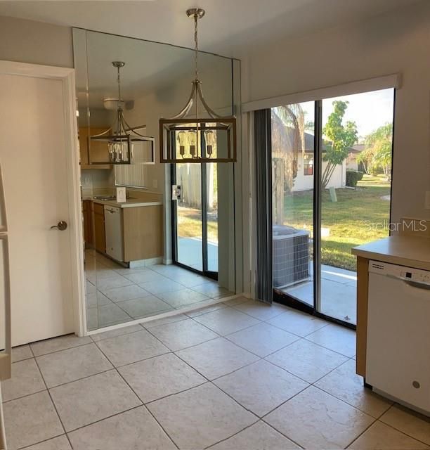 This breakfast nook is beautifully situated by the sliding glass doors, for a little sunshine with your morning coffee.