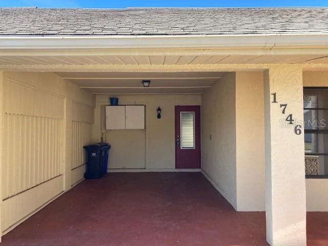 Carport, with entry into kitchen.