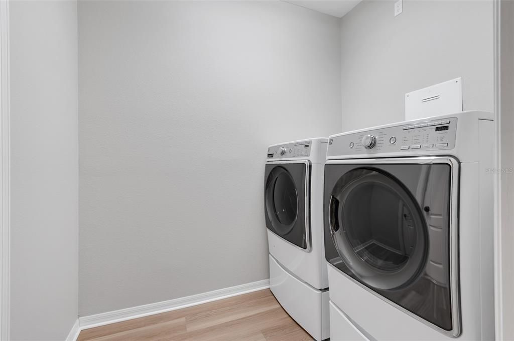 Home features laundry room with washer and dryer!