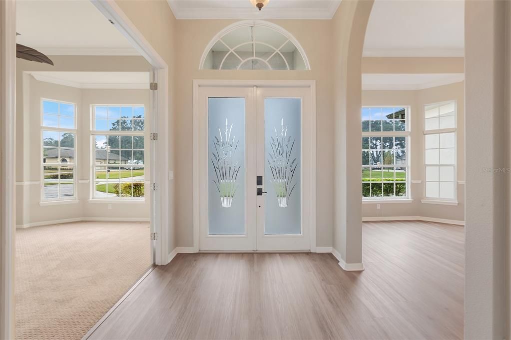 Elegant entryway that leads to both the Den/Office and the Separate Dining Room.