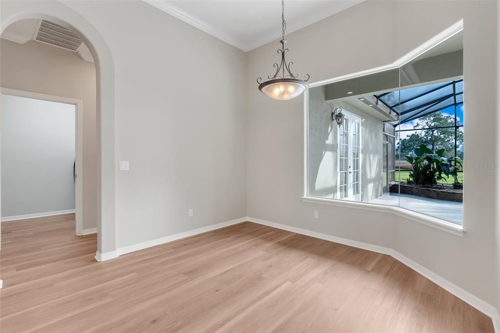 Primary Bedroom with stunning views and elegant French Doors that lead to your lanai; perfect for a quick dip in your private pool.