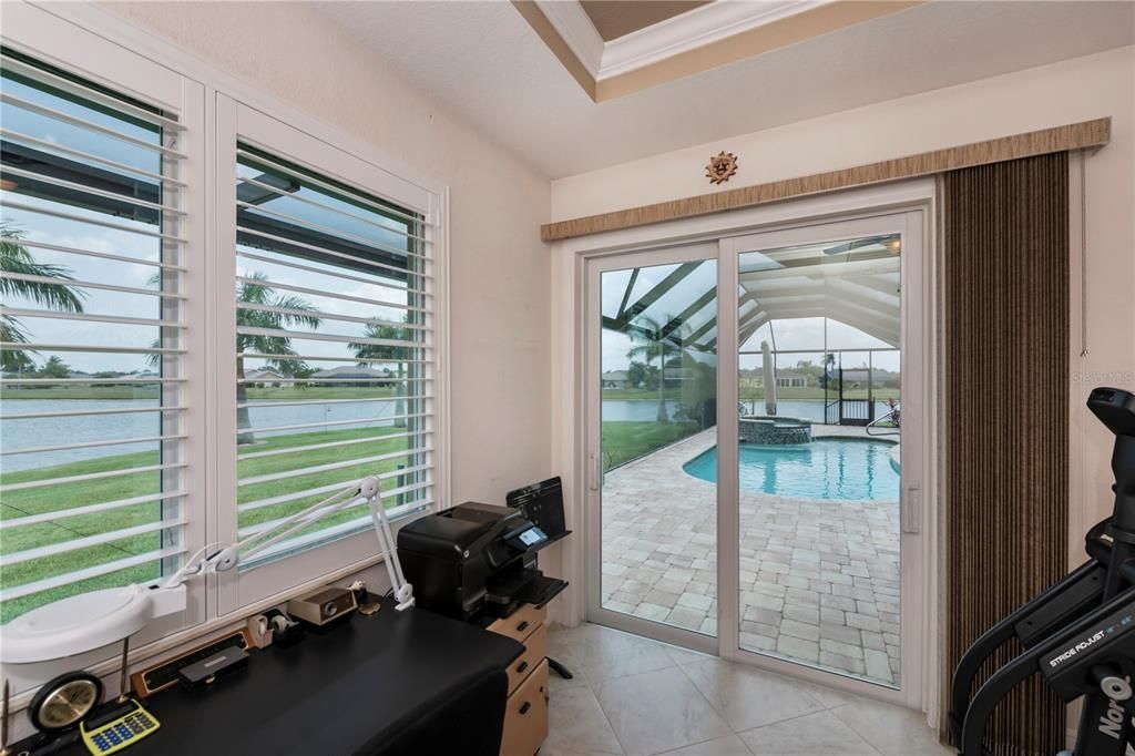 3rd bedroom has pool access, water views and oversized, currently an office