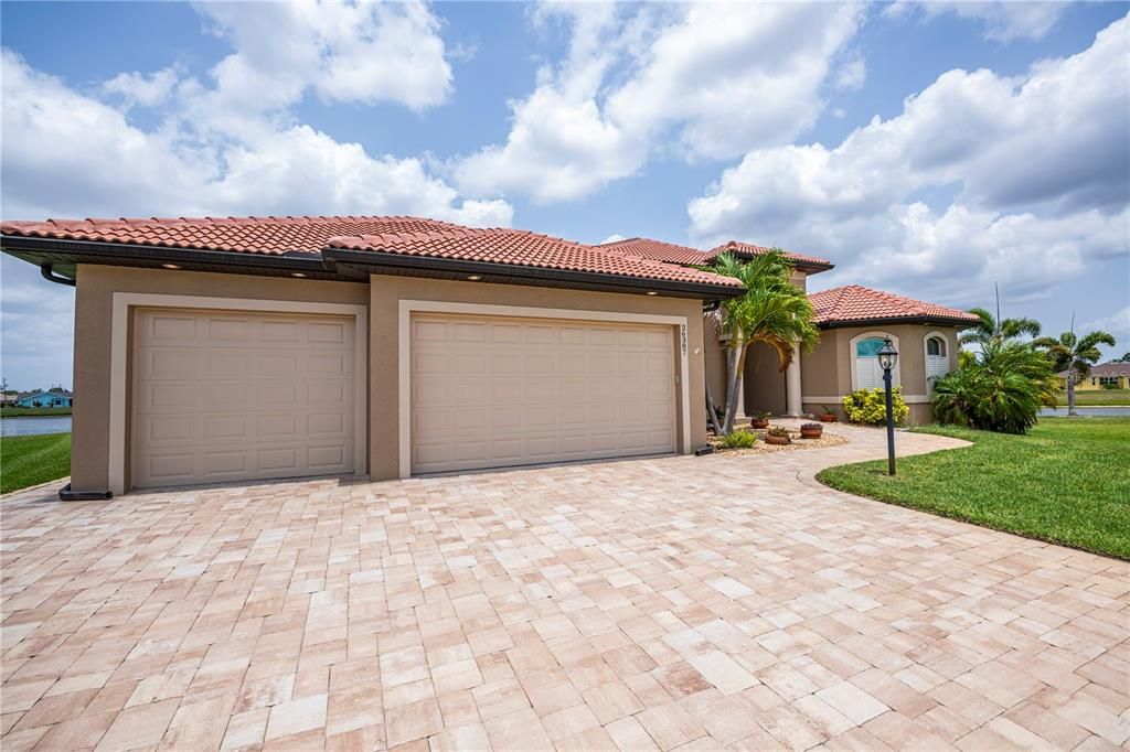 rich paver driveway for 3 car garage