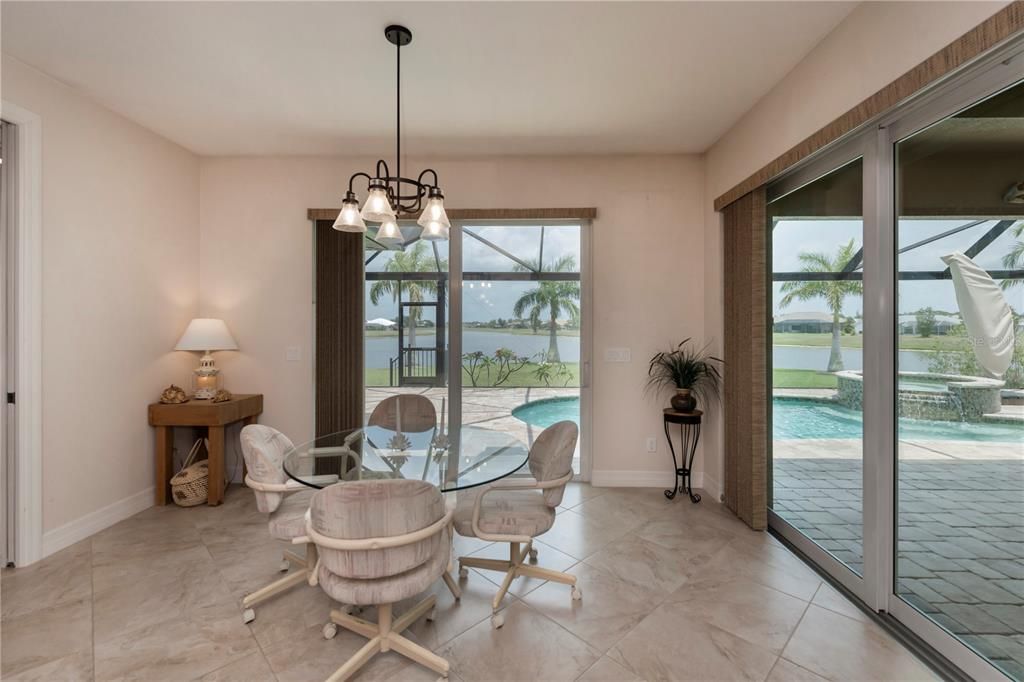 dinette with pool access and off kitchen also has magnificent views