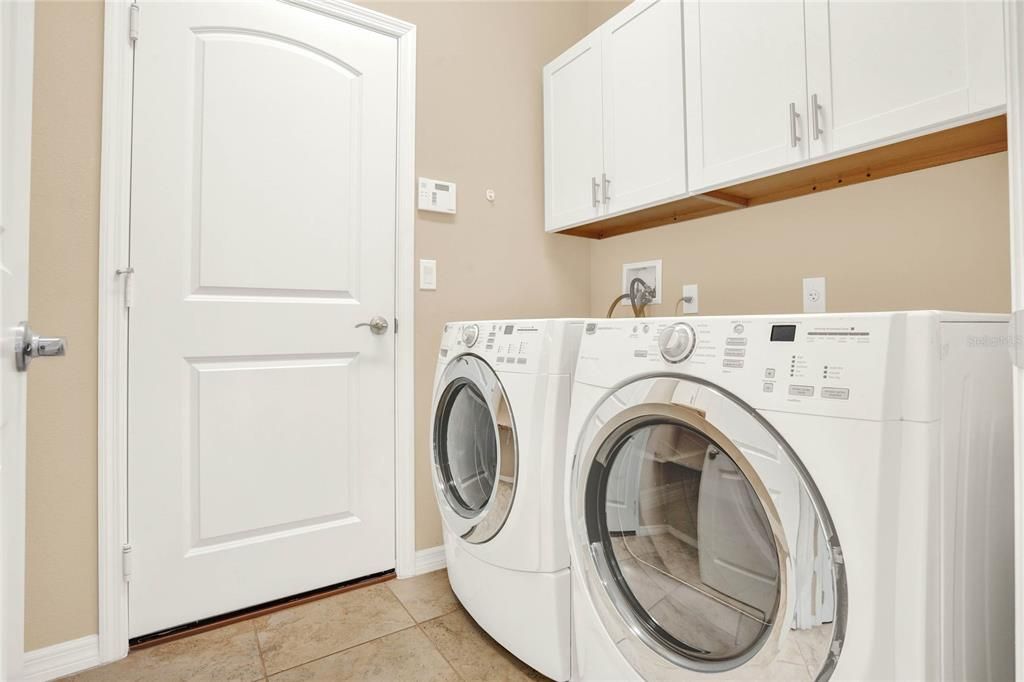 INSIDE LAUNDRY OFFERS ADDED CABINETS FOR STORAGE AND HAS ADJACENT SPACE FOR MORE AND OWNERS LEFT A NICE WASHER AND DRYER FOR NEW OWNERS!