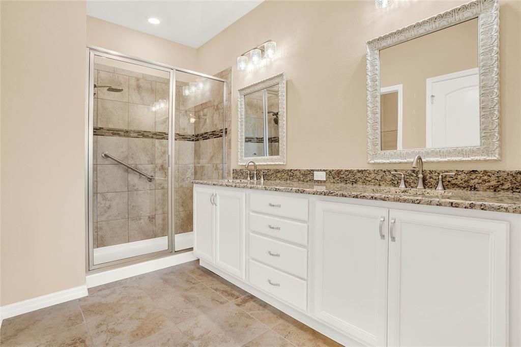 GENEROUS ENSUITE OFFERS THE PRIMARY GRANITE TOP VANITY WITH DUAL SINKS, GENEROUS STORAGE & LARGE WALK-IN CLOSET!