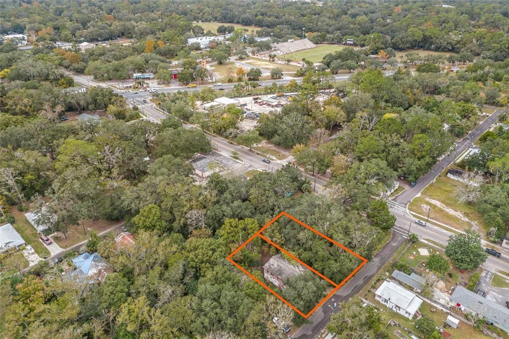 Lot for sale is shown on the North side of the adjoining lot that has a structure.