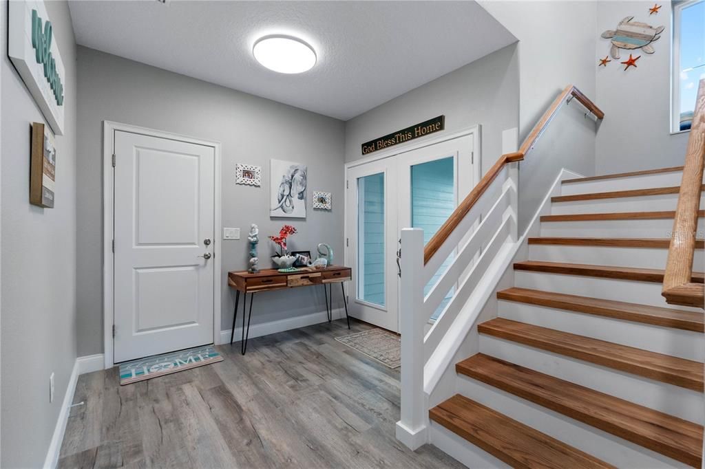 Take the Gorgeous Wood Stairs Up To The Primary Home OR..