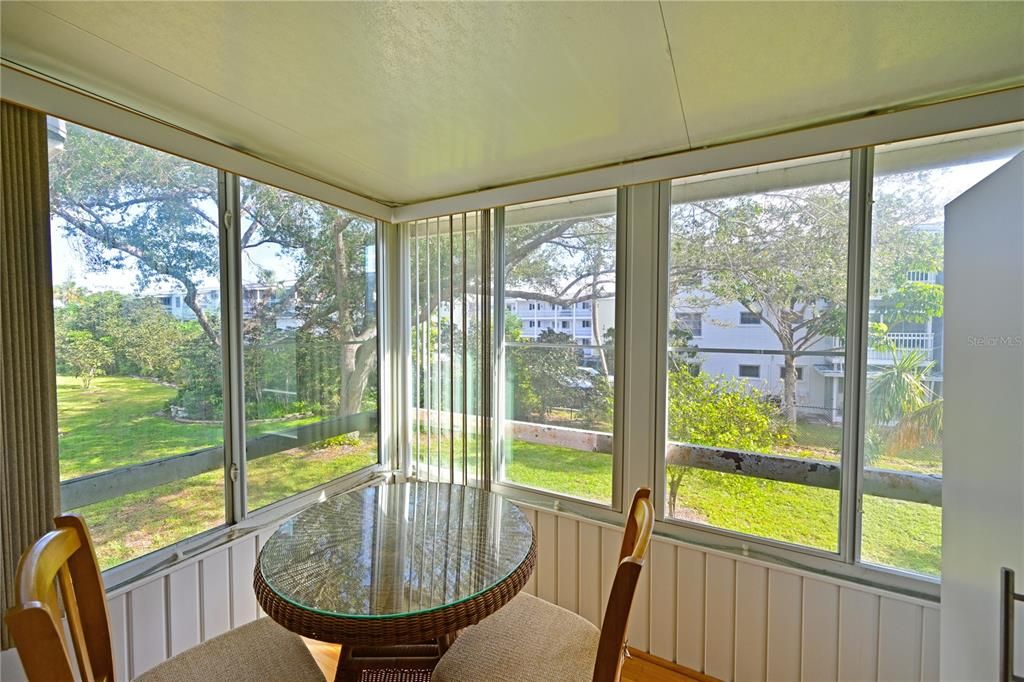 enclosed balcony overlooking tropical landscaping