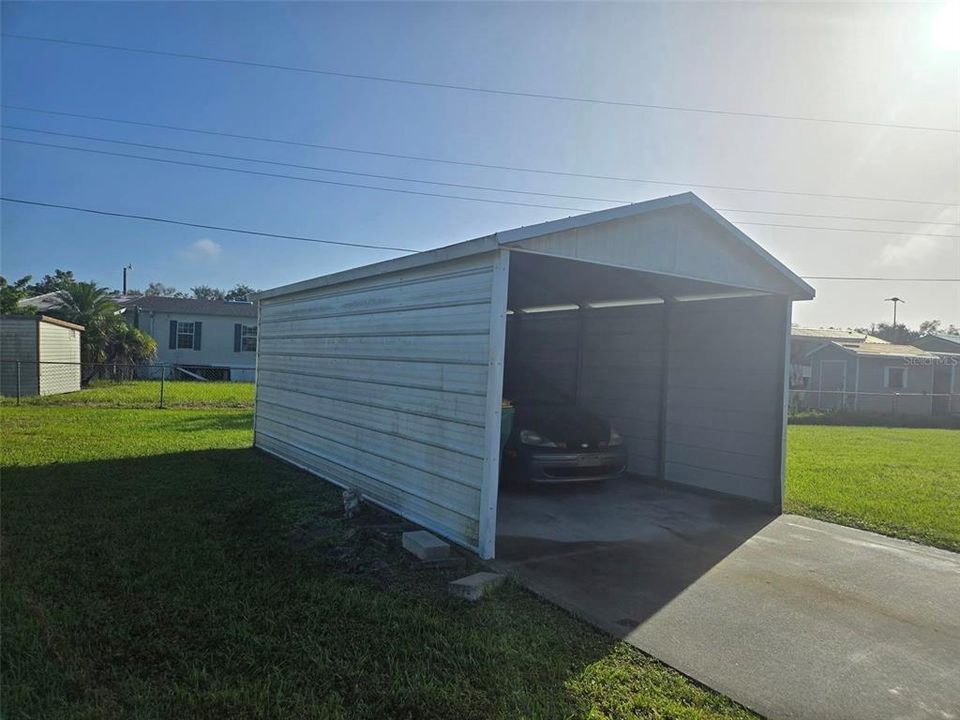 Carport and driveway.