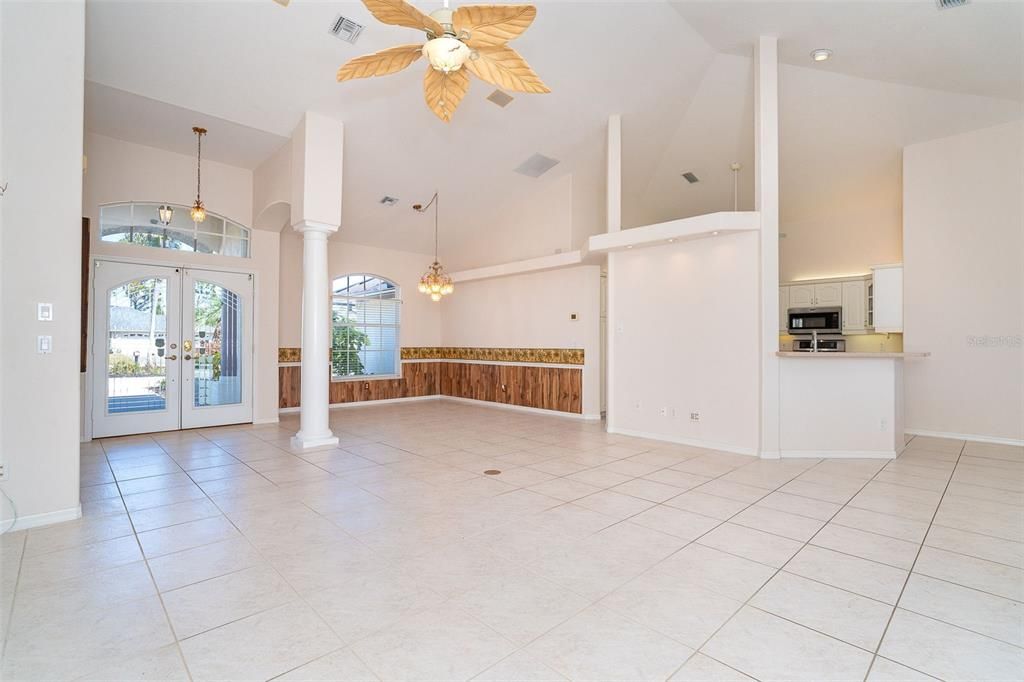 Living Room facing formal dining and kitchen