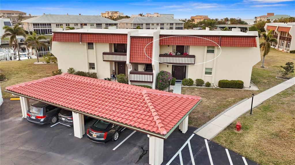 Condo and 1 reserved carport spot.