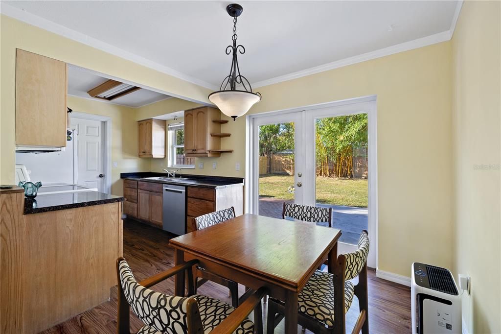 Dinning area featuring French doors that open to the backyard.