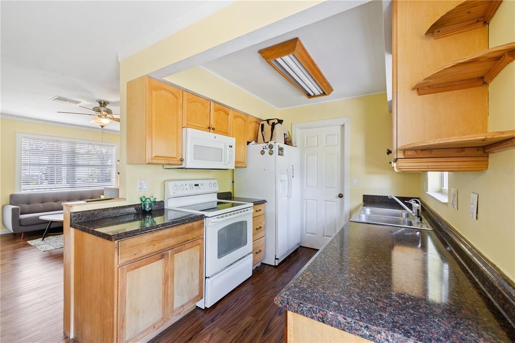 Kitchen area featuring an abundance of cabinet storage.