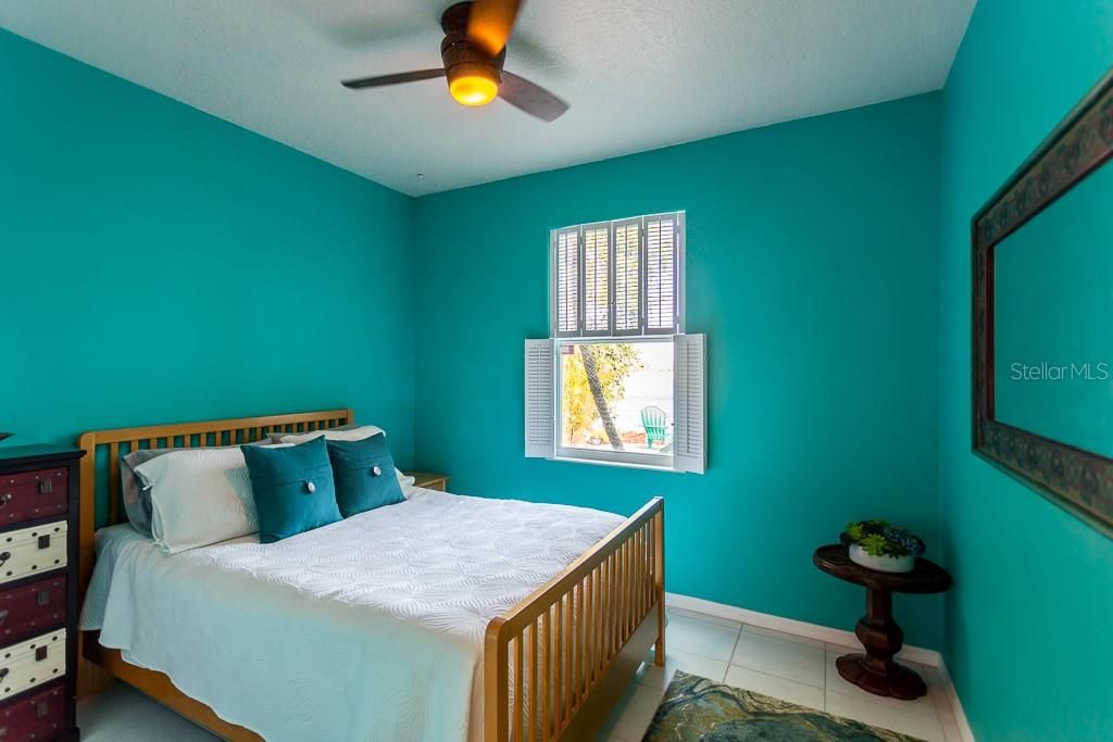 Bedroom 2 with ceramic tile continued into it.