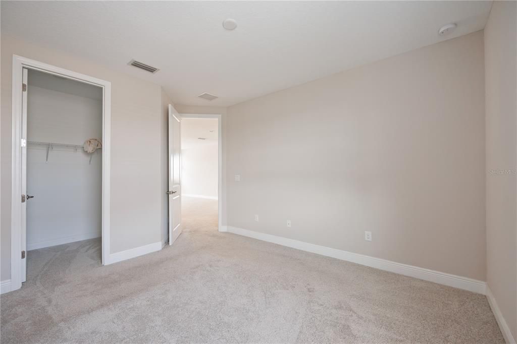 Guest bedroom with a closet