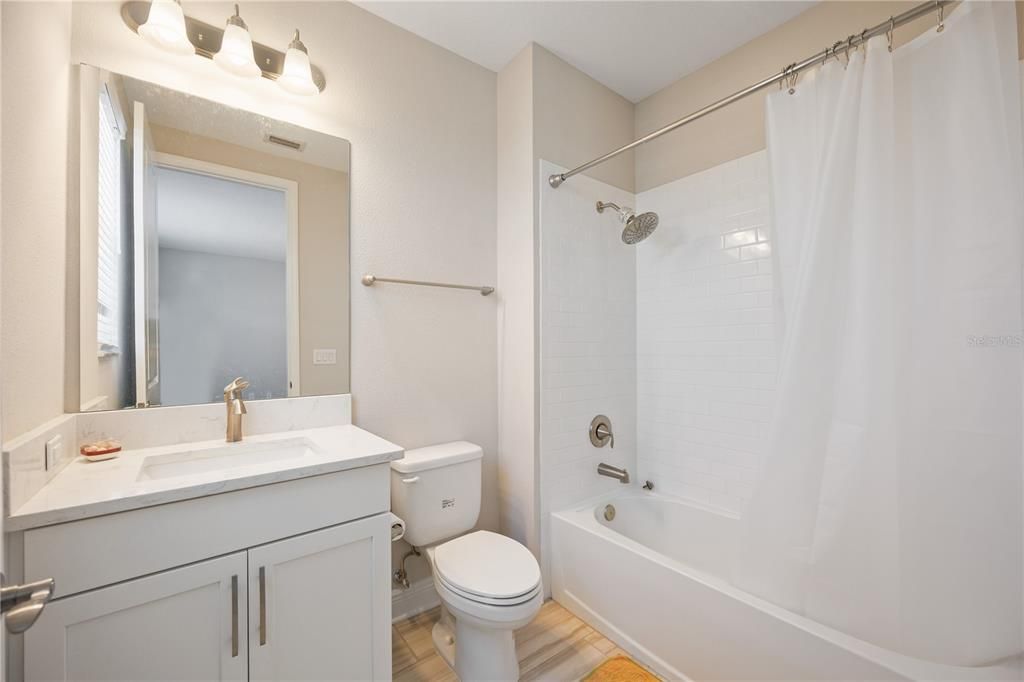 Guest bathroom with a tub