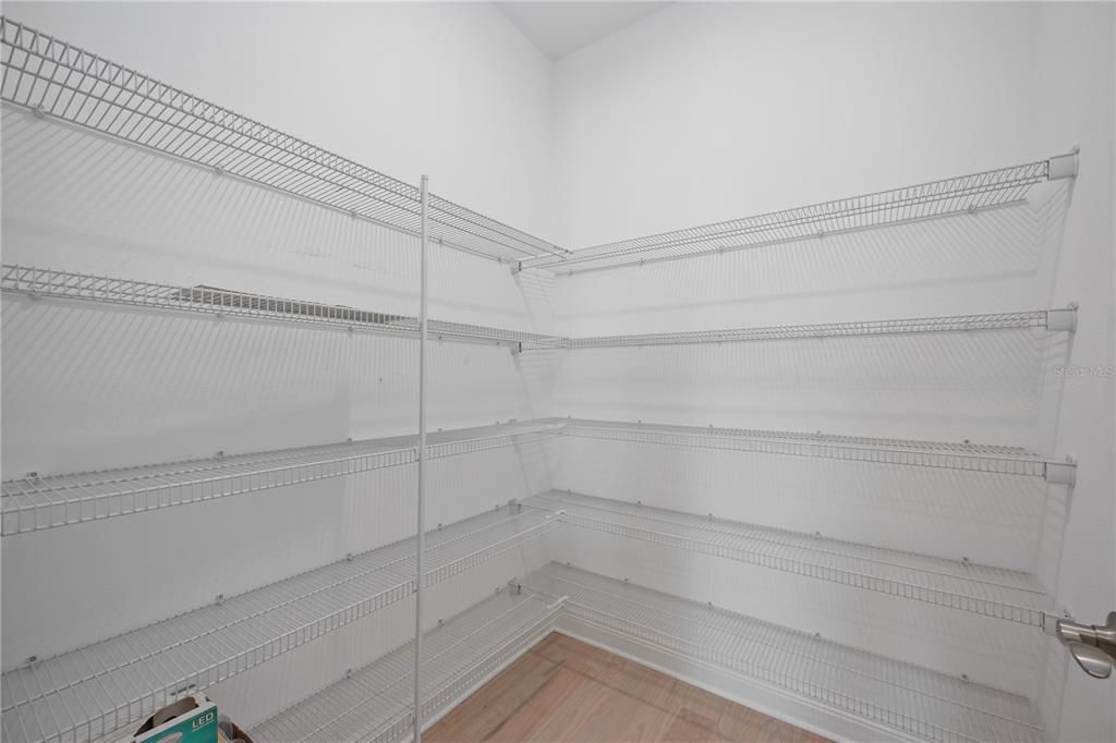 Spacious walk-in closet with shelving system