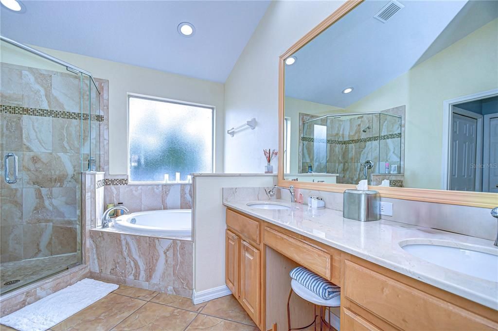 Large walk-in shower and dual sinks with makeup vanity!