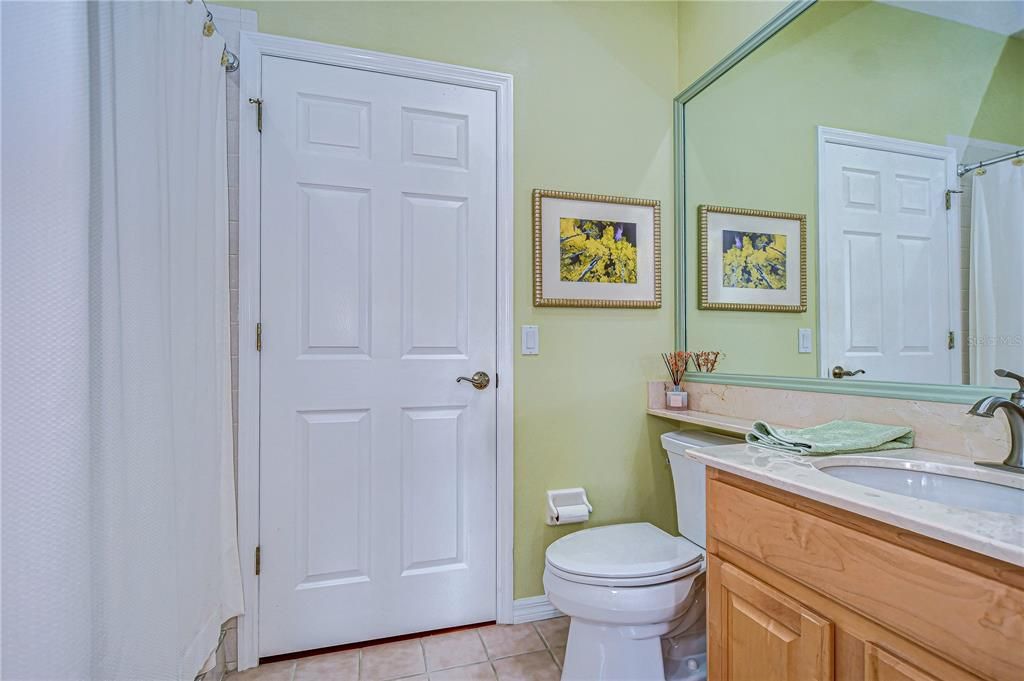 Downstairs bedroom features a airy and light attached bath!