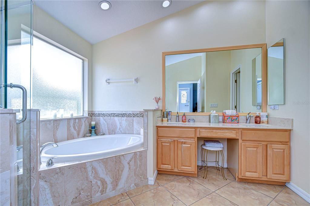 Walk in tile shower with separate soaking tub!