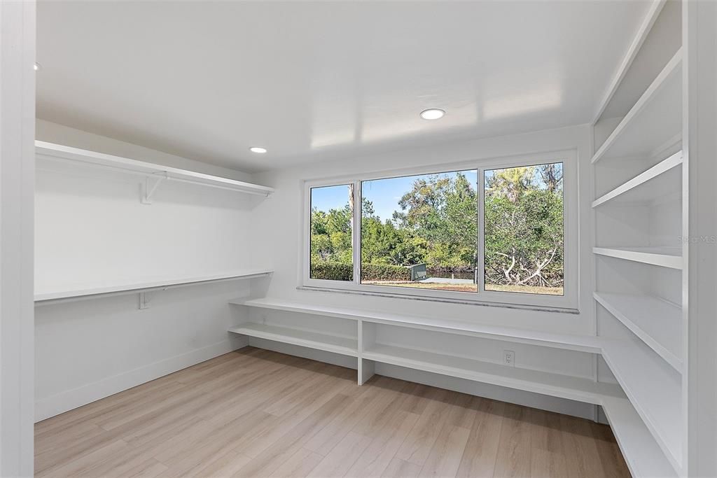 Primary Walk-In Closet with Washer and Dryer hookup.