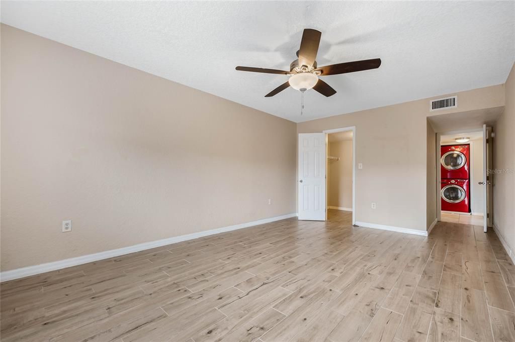 Primary Bedroom with wood like tile flooring