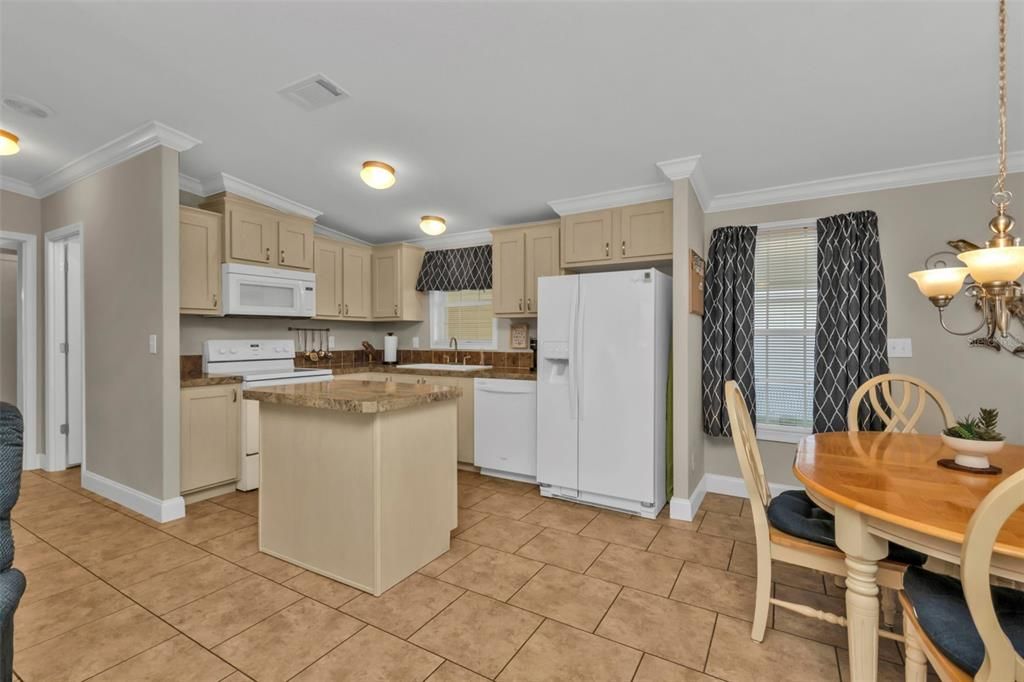 Kitchen from living area and viewing dining room